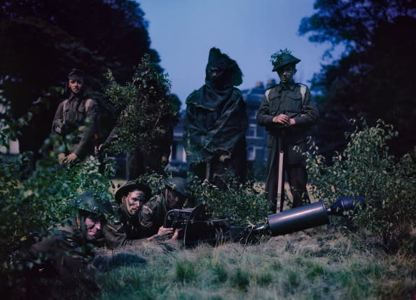 <p>Home Guard volunteers practise their camouflage skills during an exercise in 1943. (Popperfoto/Getty Images)</p>