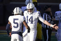 Penn State quarterback Sean Clifford (14) celebrates his team's win over Michigan with wide receiver Jahan Dotson (5) after an NCAA college football game, Saturday, Nov. 28, 2020, in Ann Arbor, Mich. (AP Photo/Carlos Osorio)