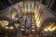 Cubicles erected inside Salisbury Cathedral, for people to receive a dose of the Pfizer-BioNTech coronavirus vaccine, in Salisbury, England, Saturday, Jan. 16, 2021. Vaccination centers are being opened in England at some of the country's great cathedrals. Salisbury Cathedral, which also houses a copy of the Magna Carta, opened its great nave to the public. Others will follow as the rollout continues. Organ music played as the jabs were delivered at Salisbury and requests were even taken. (Steve Parsons/PA via AP)