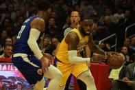 Jan 31, 2019; Los Angeles, CA, USA; Los Angeles Lakers forward LeBron James (23) moves down court defended by LA Clippers forward Mike Scott (30) in the first half at Staples Center. Mandatory Credit: Richard Mackson-USA TODAY Sports