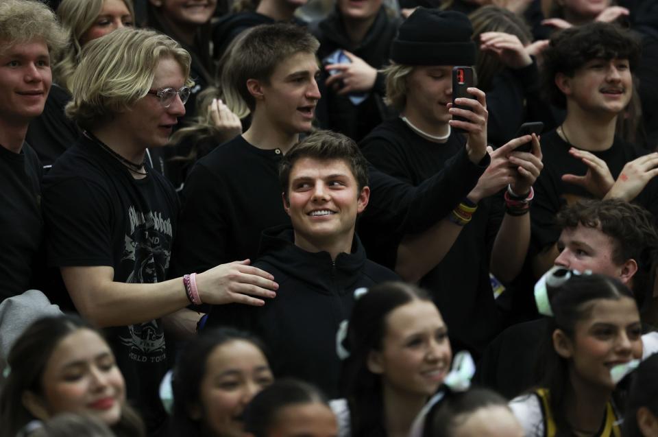 New York Jets quarterback Zach Wilson takes photos with Cottonwood High School students after a basketball game against Hillcrest High at Cottonwood High in Murray on Wednesday, Feb. 7, 2024. | Laura Seitz, Deseret News