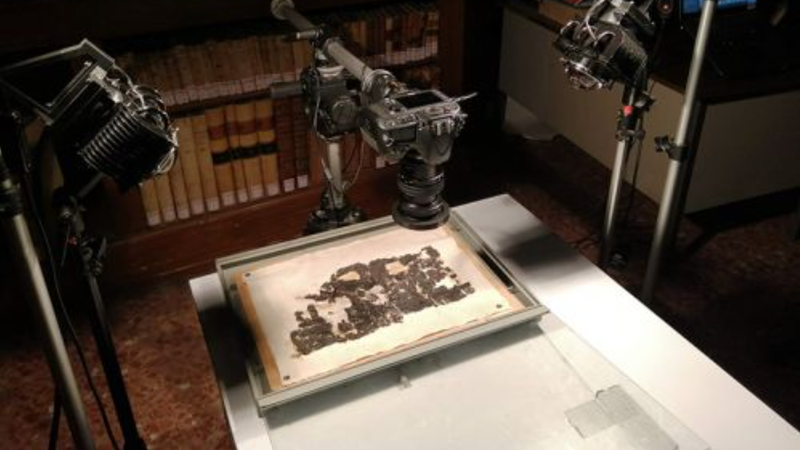 A carbonized papyrus scroll being imaged. - Photo: Italian National Research Council