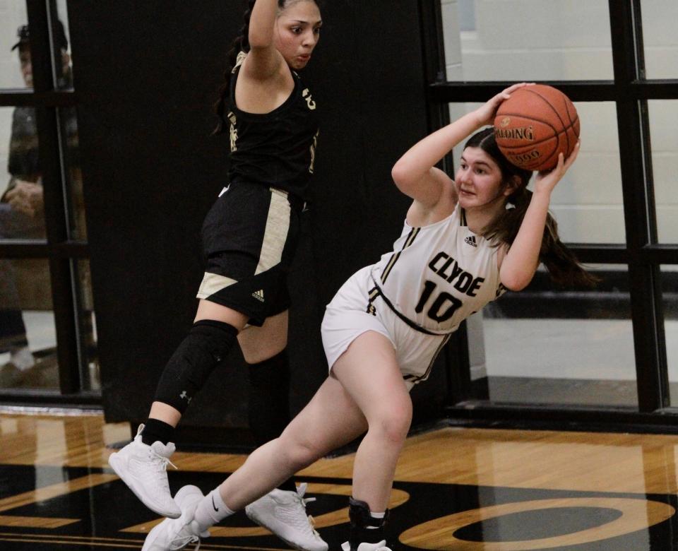 Clyde's Avery Hafner saves a ball from going out of bounds against Brady on Tuesday.