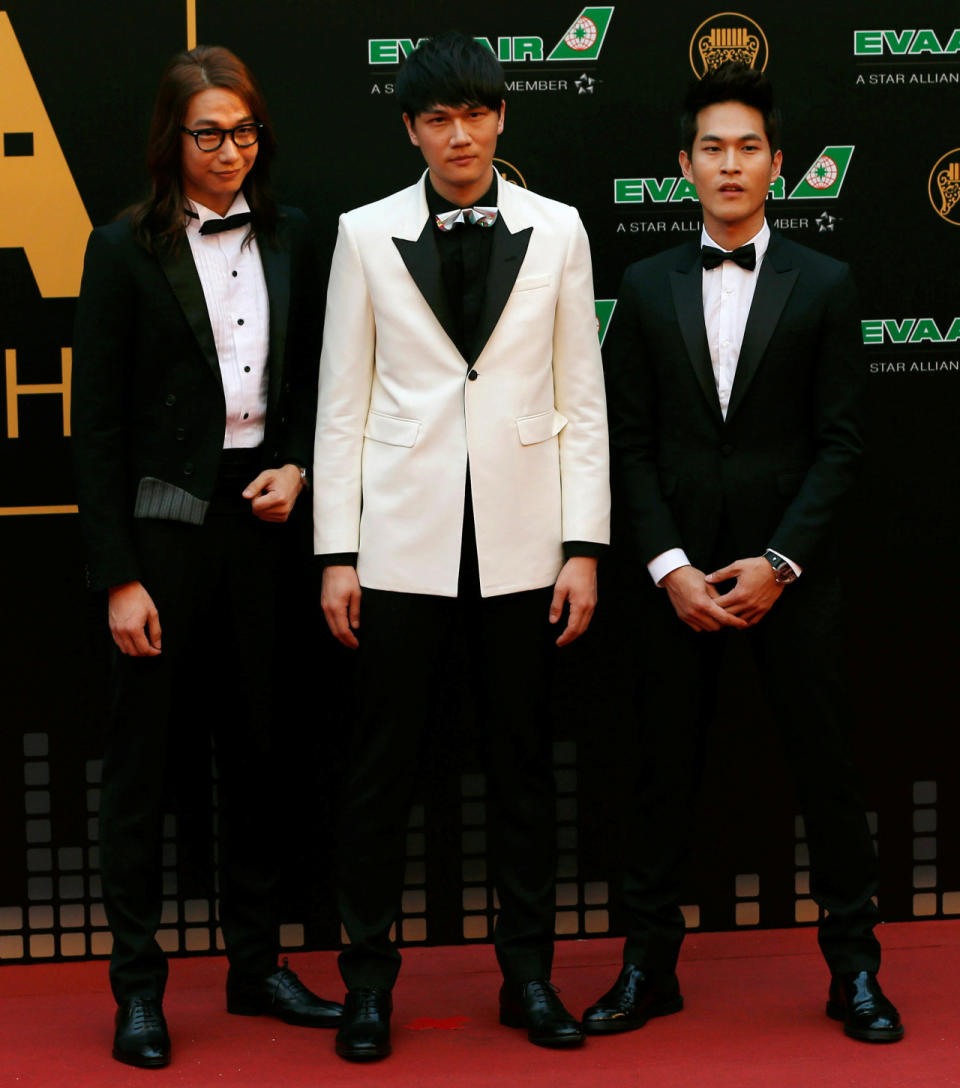 Members of Taiwanese band “Cosmospeople” pose on the red carpet at the 27th Golden Melody Awards in Taipei, Taiwan June 25, 2016. (Reuters/Tyrone Siu)