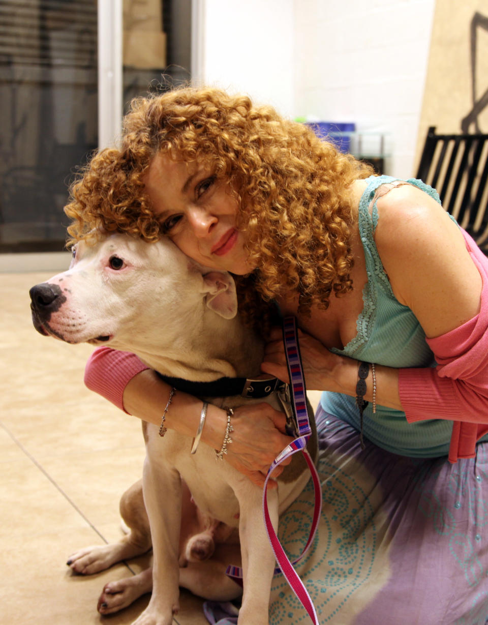 This July 8, 2013 photo shows actress Bernadette Peters with Chili, a 9-year-old Staffordshire Bull Terrier, at the Brooklyn Animal Resource Coalition in the Williamsburg section of the Brooklyn borough of New York. Chili will be part of Saturday’s Broadway Barks adopt-a-thon near Times Square. (AP Photo/Mark Kennedy)