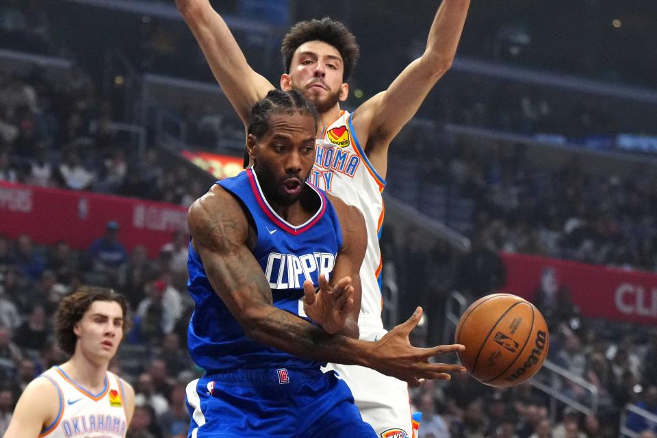 Jan 16, 2024; Los Angeles, California, USA; LA Clippers forward Kawhi Leonard (2) passes the ball against Oklahoma City Thunder forward Chet Holmgren (7) in the first half at Crypto.com Arena. Mandatory Credit: Kirby Lee-USA TODAY Sports