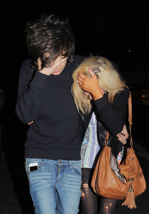 Celebrity photos: Frankie Cocozza is never normally one to shy away from the cameras, however as he left a London club with a mystery blonde girl, he hid his face from the paps. Aw, why so shy Frankie?