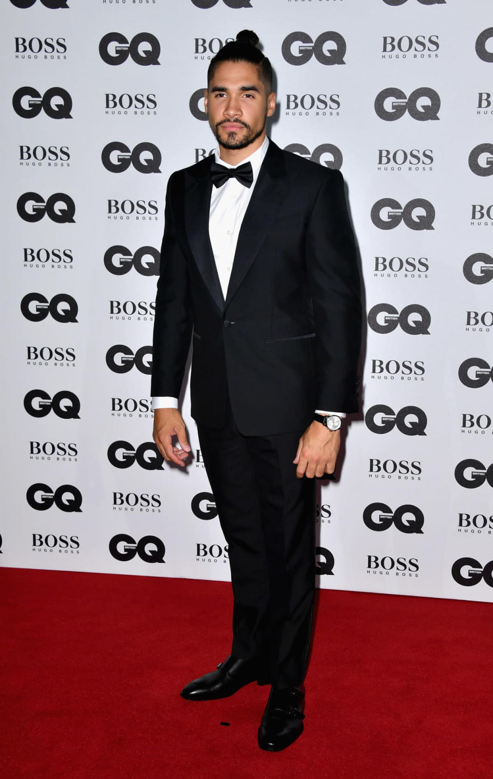 Louis Smith, topknot in place, kept things simple in a black suit. 