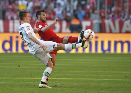 Football Soccer - Bayern Munich v Borussia Moenchengladbach - German Bundesliga - Allianz-Arena, Munich, Germany 30/04/16 - Borussia Moenchengladbach's Patrick Herrmann and Bayern Munich's Juan Bernat in action. REUTERS/Michaela Rehle