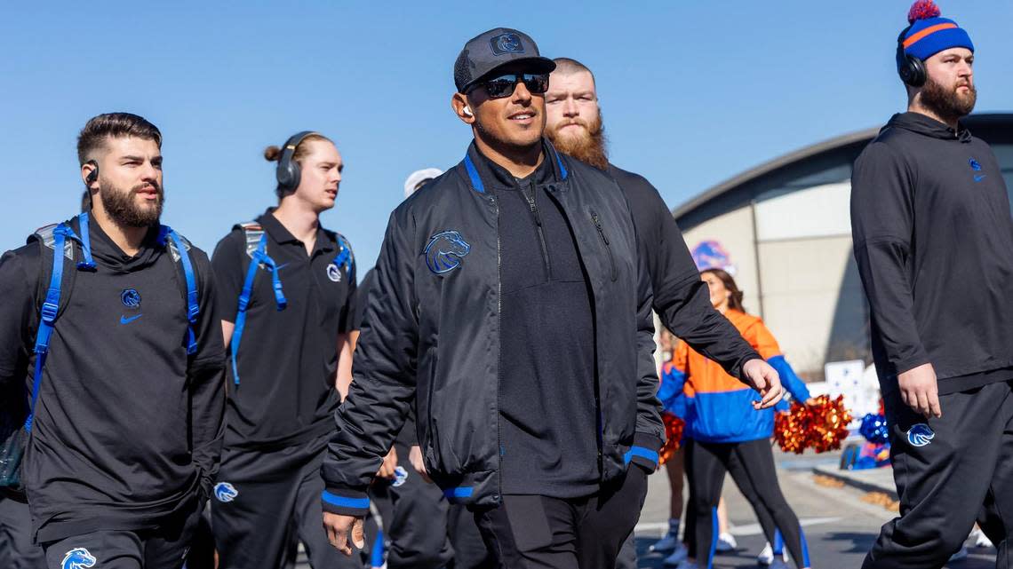 The Boise State University football team including coach Andy Avalos, center, walks into Albertsons Stadium for the game against Wyoming, Saturday, Oct. 28, 2023. Sarah A. Miller/smiller@idahostatesman.com