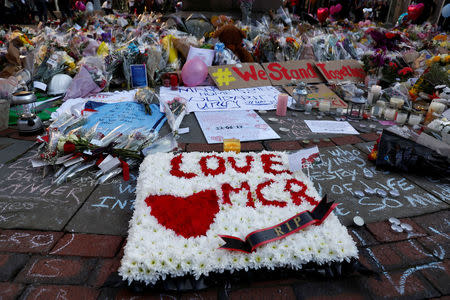 Flowers and messages of condolence are left for the victims of the Manchester Arena attack, in central Manchester, Britain May 25, 2017. REUTERS/Stefan Wermuth