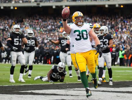 FILE PHOTO: Dec 20, 2015; Oakland, CA, USA; Green Bay Packers fullback John Kuhn (30) celebrates after scoring a touchdown against the Oakland Raiders during the first quarter at O.co Coliseum. Mandatory Credit: Kelley L Cox-USA TODAY Sports / Reuters Picture Supplied by Action Images