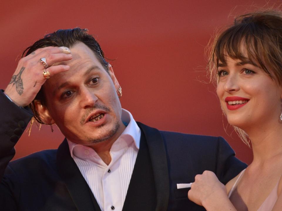 Johnny Depp and Dakota Johnson (AFP via Getty Images)