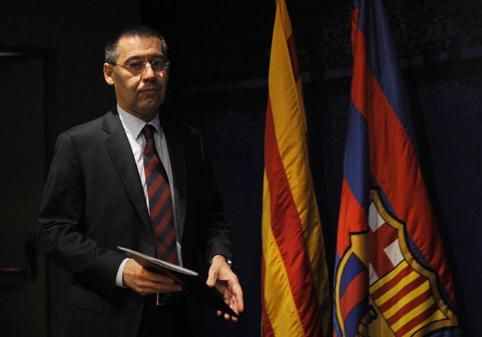 FC Barcelona's President Josep Maria Bartomeu arrives for a press conference at the Camp Nou stadium in Barcelona, Spain, Friday, Jan 24, 2014. Barcelona says its board of directors is calling an ''extraordinary'' meeting, fueling Spanish media reports that club president Sandro Rosell is under pressure to consider stepping down due to the lawsuit regarding Neymar's transfer. Barcelona said in a statement that the meeting will take place on Thursday afternoon, a day after a judge agreed to hear a lawsuit brought by a Barcelona club member over the cost of Neymar's signing. (AP Photo/Manu Fernandez)