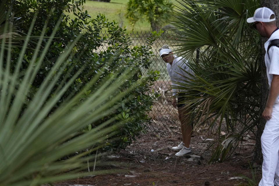 Nanna Koerstz Madsen, of Denmark, finds her ball in the rough during the final round of the LPGA Tour Championship golf tournament, Sunday, Nov. 21, 2021, in Naples, Fla. (AP Photo/Rebecca Blackwell)