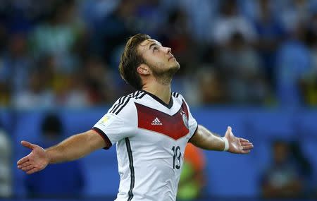 Germany's Mario Goetze celebrates after scoring against Argentina during extra time in their 2014 World Cup final at the Maracana stadium in Rio de Janeiro July 13, 2014. REUTERS/Eddie Keogh