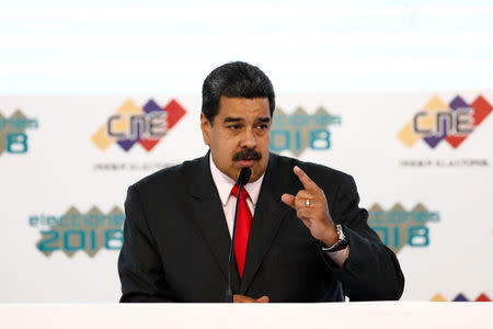 Venezuela's re-elected President Nicolas Maduro adresses the audience during the ceremony to receive a certificate given by the National Electoral Council (CNE), confirming him as winner of Sunday's election, in Caracas, Venezuela May 22, 2018. REUTERS/Marco Bello