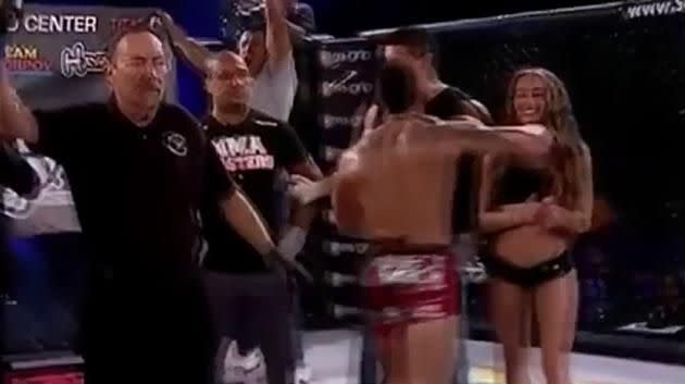 Contact is made with the ring girl. Pic: Youtube