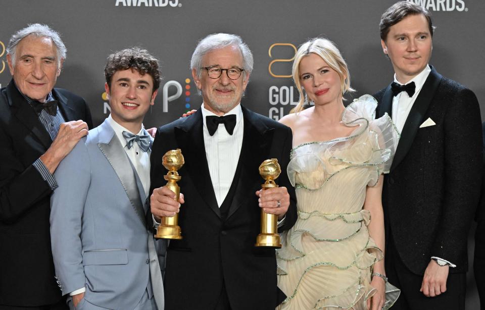 Judd Hirsch, left, Gabriel LaBelle, Steven Spielberg, Michelle Williams and Paul Dano pose with Golden Globes trophies for "The Fabelmans."