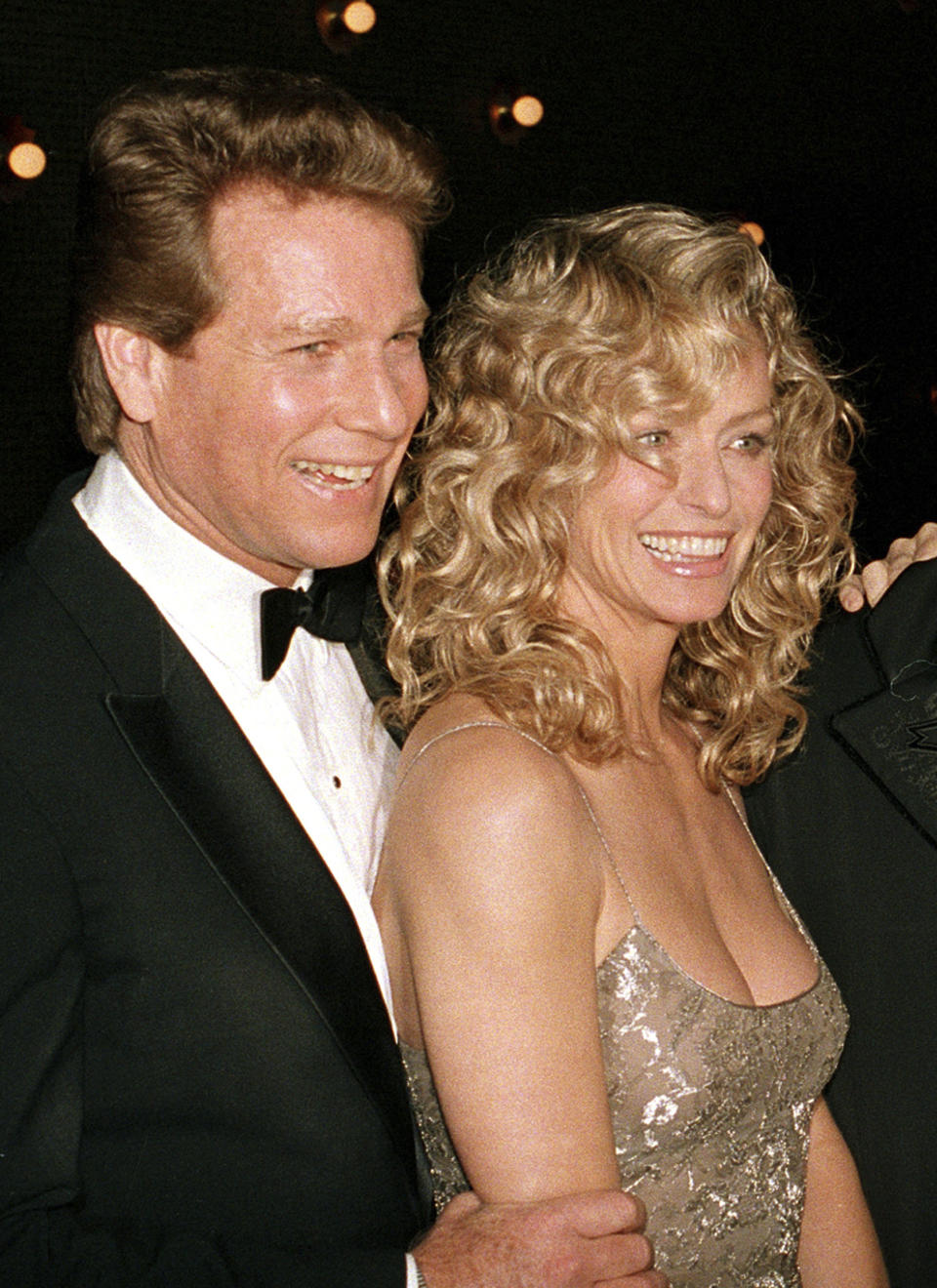 FILE - Actors Ryan O'Neal, left, and Farrah Fawcett are shown at the premiere of the film. "Chances Are," March 5, 1989, in New York. O’Neal, who was nominated for an Oscar for the tear-jerker “Love Story” and played opposite his precocious daughter Tatum in “Paper Moon,” has died. O’Neal's son Patrick said on Instagram that his father died Friday, Dec. 8, 2023. (AP Photo/Ray Stubblebine, File)