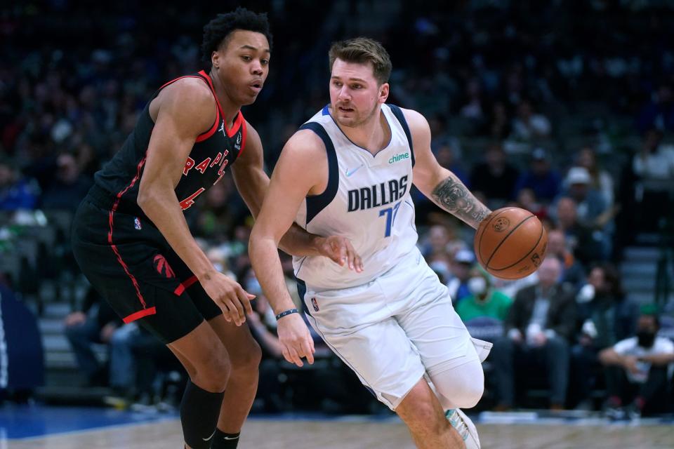 Dallas Mavericks guard Luka Doncic (77) drives against Toronto Raptors forward Scottie Barnes (4) during the first quarter of an NBA basketball game in Dallas, Wednesday, Jan. 19, 2022. (AP Photo/LM Otero)