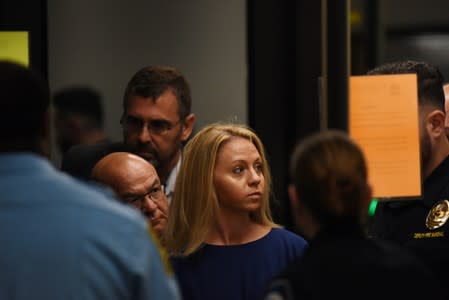 Amber Guyger, who is charged in the killing of Botham Jean in his own home, arrives on the first day of the trial in Dallas