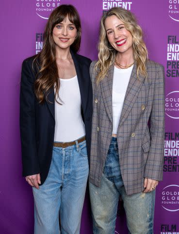 <p>Amanda Edwards/Getty</p> Dakota Johnson and Christy Hall