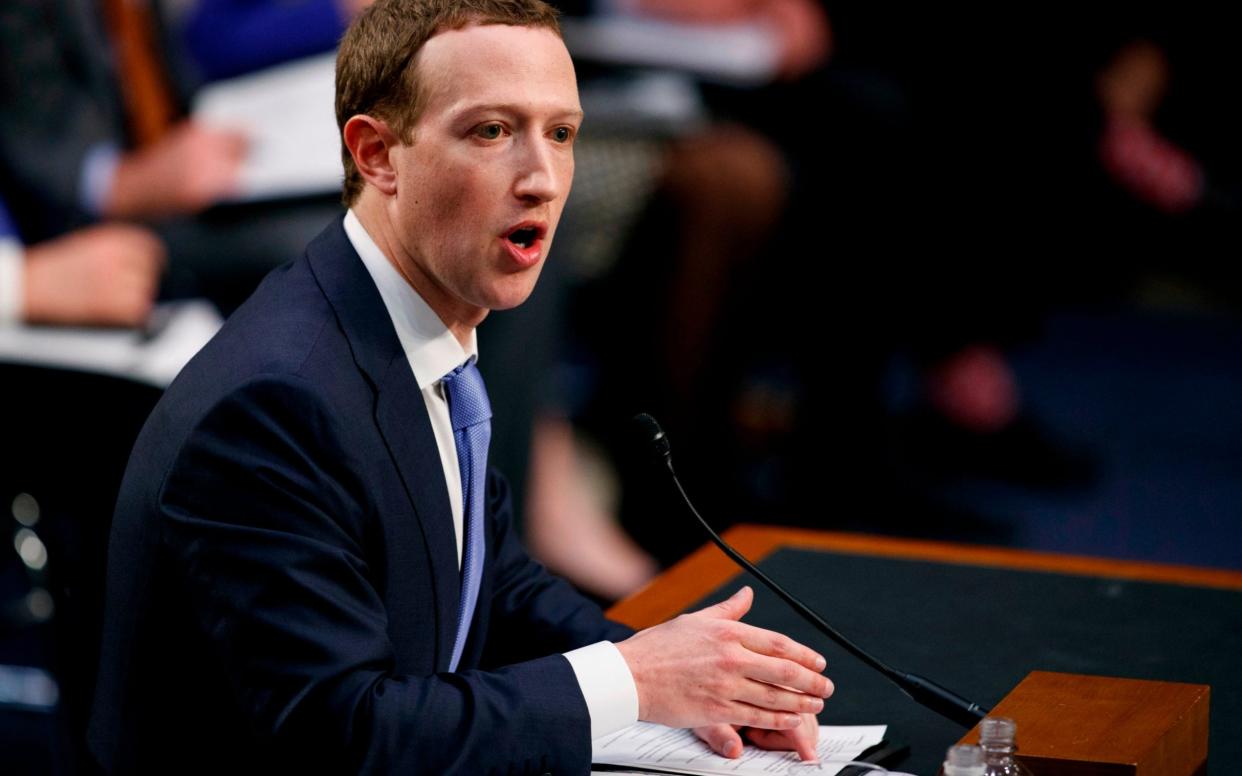 Facebook CEO Mark Zuckerberg testifies before a joint hearing of the Commerce and Judiciary Committees on Capitol Hill in Washington, Tuesday, April 10, 2018, about the use of Facebook data to target American voters in the 2016 election - Carolyn Kaster/AP