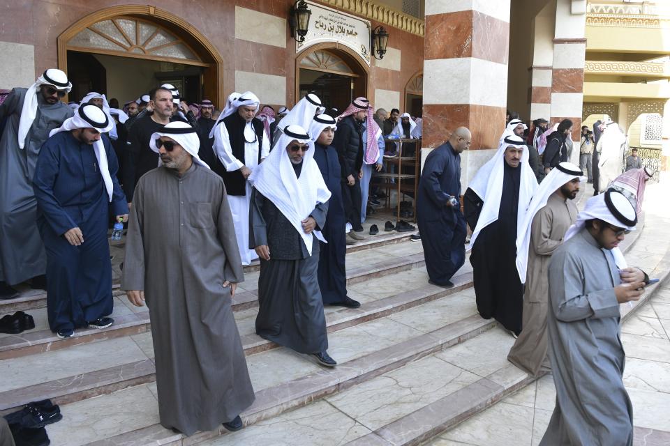 People leave after the funeral ceremony of the Emir of Kuwait Sheikh Nawaf Al Ahmad Al Sabah at the Bilal bin Rabah Mosque in Al-Siddiq district of Kuwait, Sunday, Dec. 17, 2023. Kuwait’s ruling emir, died on Saturday after a three-year, low-key reign focused on trying to resolve the tiny, oil-rich nation's internal political disputes. He was 86. (AP Photo/Jaber Abdulkhaleg)