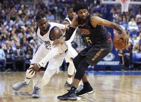 Oct 18, 2017; Dallas, TX, USA; Atlanta Hawks forward DeAndre' Bembry (95) dribbles away from Dallas Mavericks guard Wesley Matthews (23) during the second half at American Airlines Center. Mandatory Credit: Kevin Jairaj-USA TODAY Sports