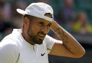 Australia's Nick Kyrgios pauses as he plays Brandon Nakashima of the US in a men's singles fourth round match on day eight of the Wimbledon tennis championships in London, Monday, July 4, 2022. (AP Photo/Alberto Pezzali)
