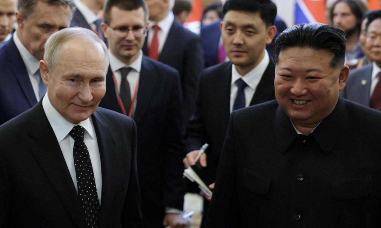 <span>Russia's President Vladimir Putin and North Korea's leader Kim Jong Un arrive for a gala concert in Pyongyang.</span><span>Photograph: Gavriil Grigorov/Reuters</span>