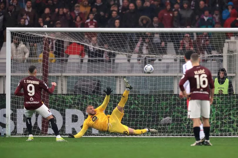 Antonio Sanabria scores a penalty past Michele Di Gregorio to give the side a 1-0 lead during the Serie A TIM match between Torino FC and AC Monza.