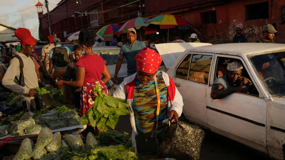 Shoppers at the Stabroek Market in Georgetown, Guyana, on April 13, 2023. More than 40% of the population lived on less than $5.50 a day when oil production began. - Matias Delacroix/AP