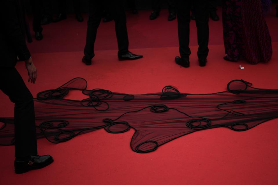 In this May 19, 2023 photo, a dress is displayed along the red carpet during the premiere of the film 'The Zone of Interest' at the 76th international film festival, Cannes, southern France. (AP Photo/Daniel Cole)