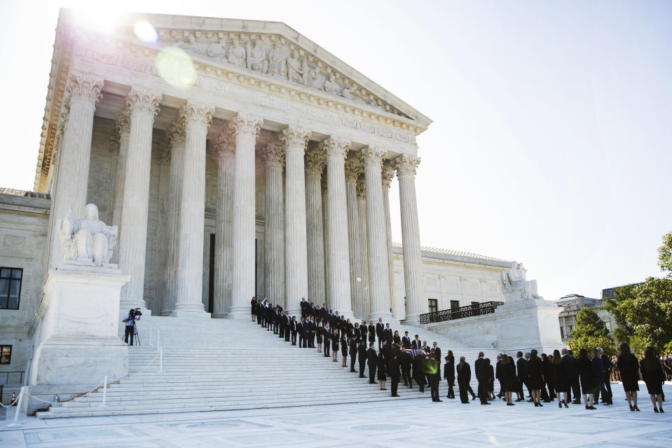 The casket of late Supreme Court Justice John Paul Stevens is carried into the U.S. Supreme Court in Washington, Monday, July 22, 2019. (AP Photo/Manuel Balce Ceneta)