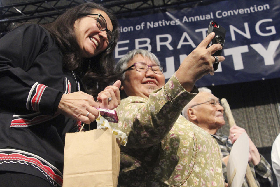 U.S. Rep. Mary Peltola, left, an Alaska Democrat, poses for a selfie with Evelyn Karmun of Nome at the Alaska Federation of Natives conference in Anchorage, Alaska, on Thursday, Oct. 20, 2022. Peltola won a special election to succeed Don Young, who held the seat for 49 years until his death in March. Peltola is the first Alaska Native to serve in Congress. (AP Photo/Mark Thiessen)