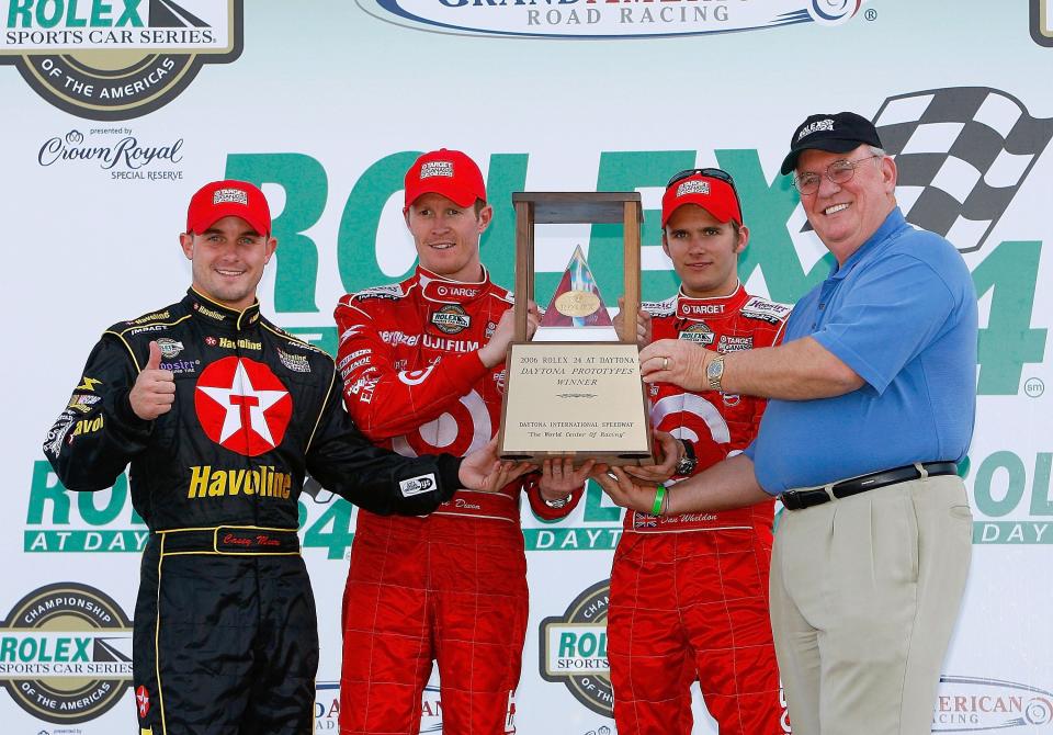 Scott Dixon's first Rolex 24 win came in 2006. In Victory Lane, left to right, Casey Mears, Dixon, Dan Wheldon and that year's Grand Marshal, Benny Parsons.