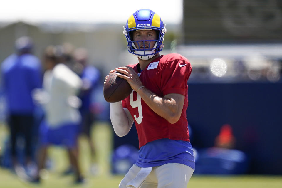 Los Angeles Rams quarterback Matthew Stafford (9) participates in drills at the NFL football team's practice facility in Irvine, Calif., Saturday, Aug. 6, 2022. (AP Photo/Ashley Landis)