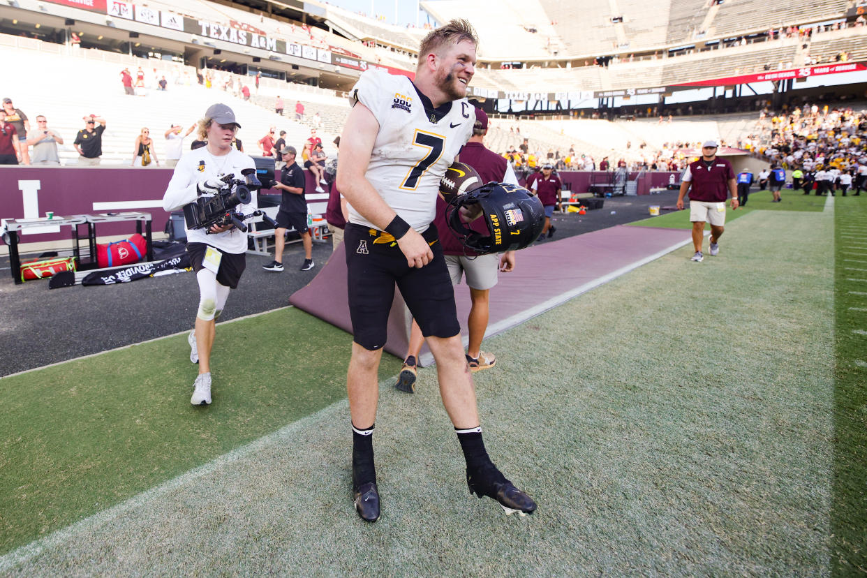 COLLEGE STATION, TEXAS - SEPTEMBER 10: Chase Brice #7 of the Appalachian State Mountaineers celebrates defeating the Texas A&M Aggies 17-14 ]at Kyle Field on September 10, 2022 in College Station, Texas. (Photo by Carmen Mandato/Getty Images)