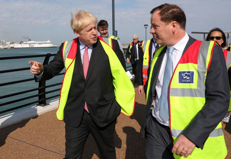 Boris Johnson speaks with Dover's Conservative MP, Charlie Elphicke during a visit to the Port of Dover Ltd. (Photo by Chris Ratcliffe / POOL / AFP) 