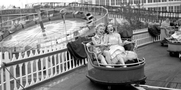 BROOKLYN - MAY 11: Models from the CBS gameshow, 'The Big Payoff,' Cindy Robbins and Pat Conway ride The Whip designed and built by W.F. Mangels Company of Coney Island, at Steeplechase Park. Coney Island, Brooklyn, NY. Image dated May 11, 1953. (Photo by CBS via Getty Images) 