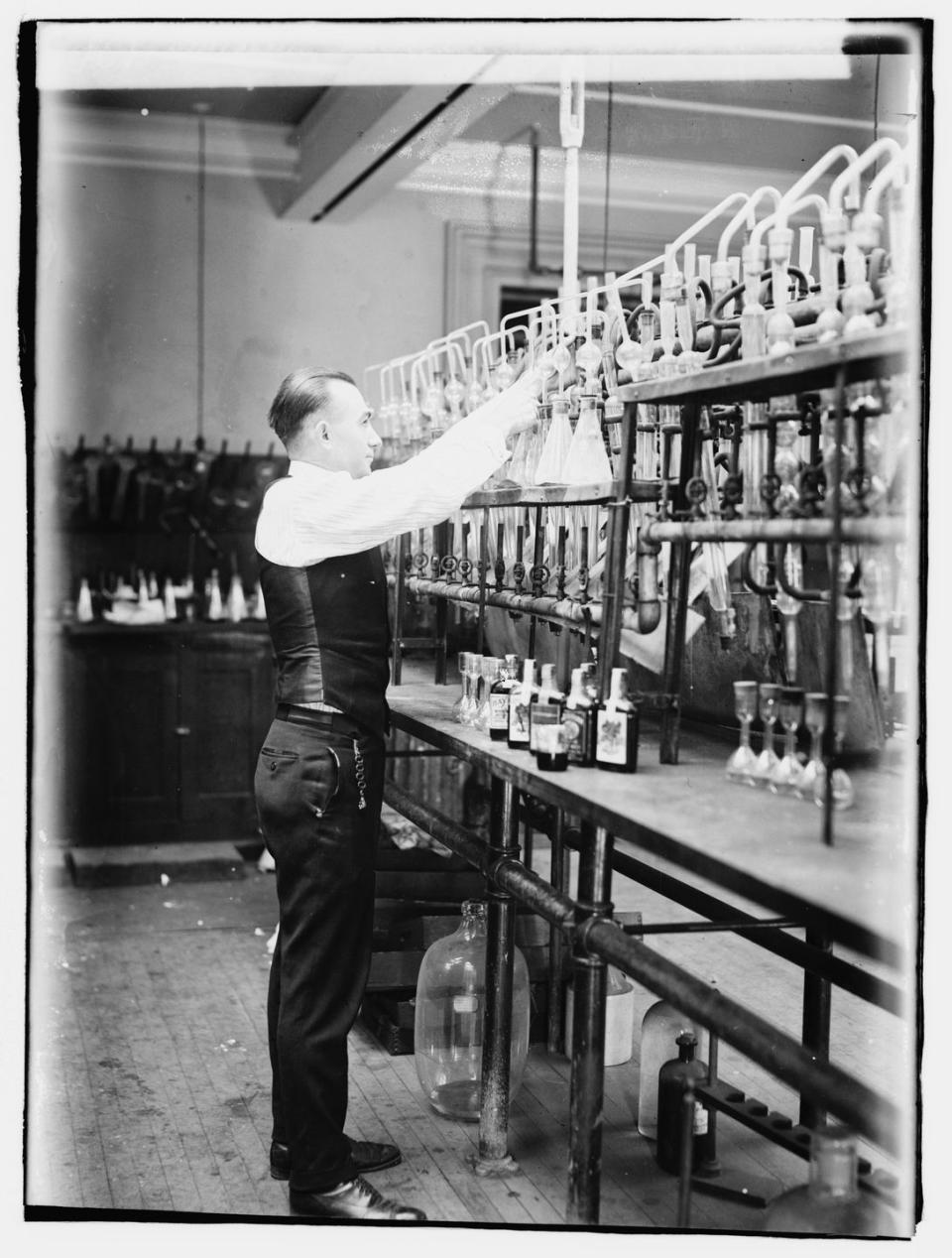 <p>A chemist tests bootleggers' booze. Prohibition on alcohol began in January 1920 and lasted until 1933.</p>