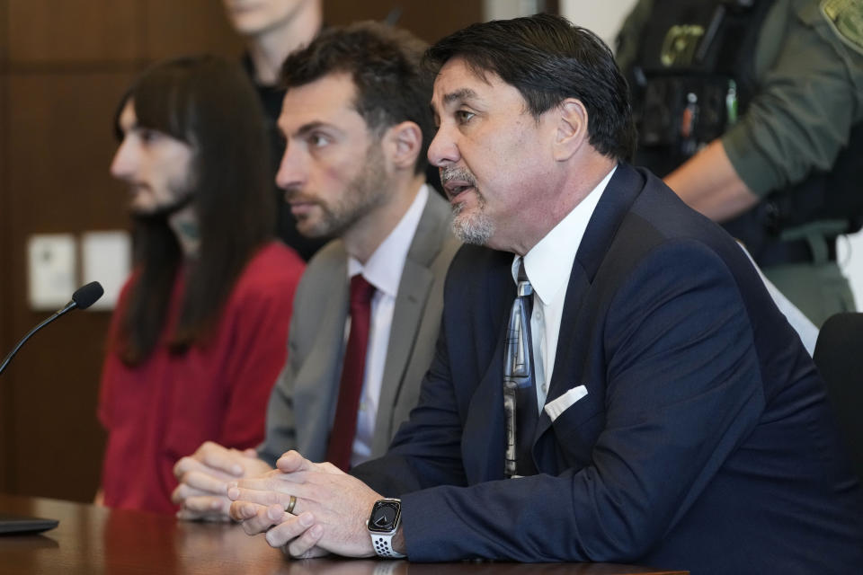 Robert E. Crimo III's attorney Gregory Ticsay, right, speaks to Judge Victoria A. Rossetti as Robert E. Crimo III., left, Anton Trizna of an assistant public defender at Lake County listen during a case management conference at the Lake County Courthouse Monday, Dec. 11, 2023, in Waukegan, Ill. Robert Crimo III, accused of killing seven and wounding dozens more at a Fourth of July parade in 2022, asked a Lake County judge to allow him to continue without the aid of his assistant public defenders and invoked his right to a speedy trial. (AP Photo/Nam Y. Huh, Pool)