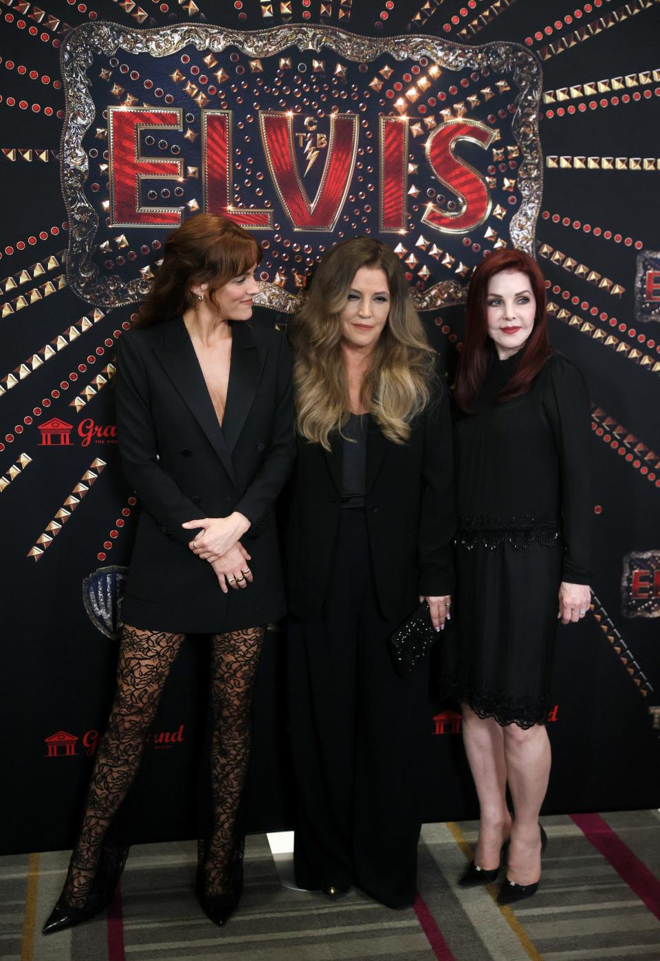 Riley Keough, from left, Lisa Marie Presley and Priscilla Presley greet the press during a red carpet event before the screening for the new biopic movie 'Elvis' at Graceland in Memphis, Tenn. on Saturday, June 11, 2022. 