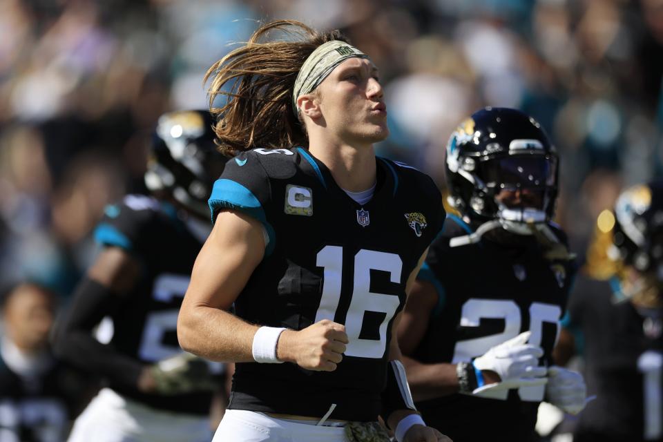 Jacksonville Jaguars quarterback Trevor Lawrence (16) runs on the field before an NFL football matchup Sunday, Nov. 19, 2023 at EverBank Stadium in Jacksonville, Fla. The Jacksonville Jaguars defeated the Tennessee Titans 34-14. [Corey Perrine/Florida Times-Union]