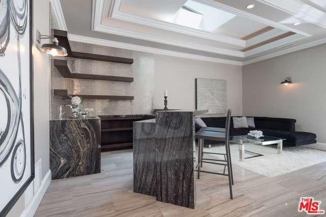 <p>This bar and lounge area is perfect for entertaining and maybe listening to Peters test out his stand up routine. <br> (Realtor.com) </p>