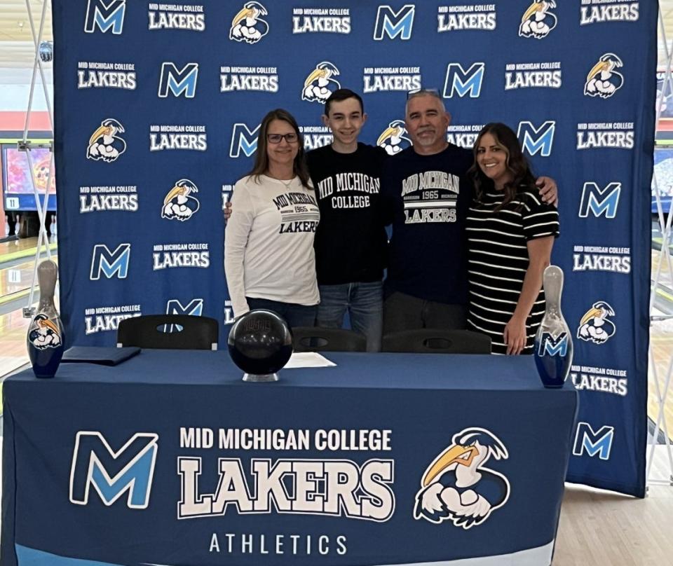 Cheboygan senior bowler Cole Swanberg stands alongside his parents, Doug and Sarah Swanberg, as well as his sister, Meriyah Shampine, after signing to bowl at Mid Michigan College next season.