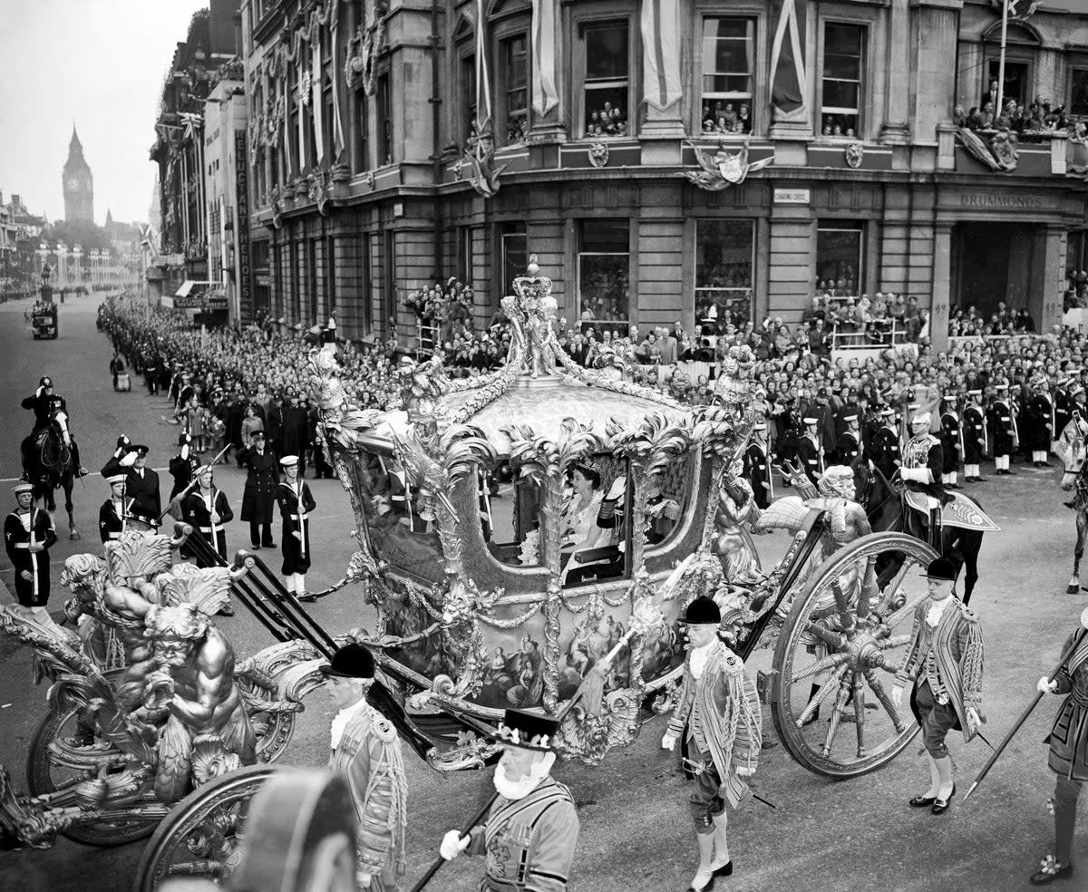 Queen Elizabeth II rides with the Duke of Edinburgh on the way to Westminster Abbey for her coronation (PA)