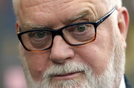 FILE PHOTO: Paul Flowers, the former chairman of the Co-operative Bank arrives at Leeds Magistrates' Court in Northern England May 7, 2014. REUTERS/Dave Thompson